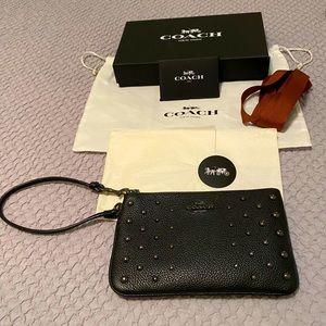 Authentic Coach wristlet, black with studs